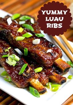 some meat on a white plate with chopsticks