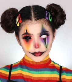 a woman with colorful makeup and clown make - up