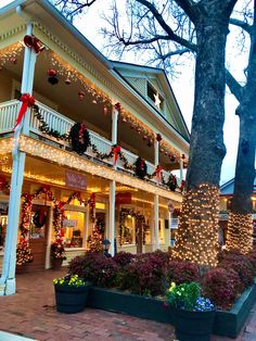 christmas decorations adorn the front of a building