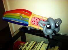 an inflatable elephant laying on top of a table