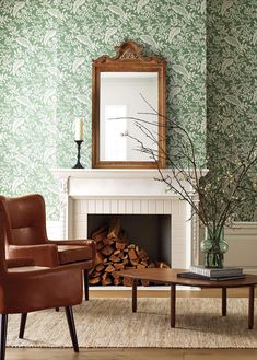 a living room filled with furniture and a fire place next to a mirror on the wall