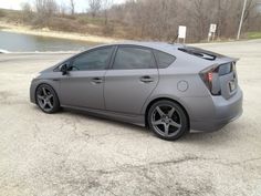 a gray car parked in a parking lot