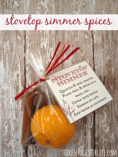 an orange is wrapped in plastic and sitting on a wooden table with the words, stovetop summer spices