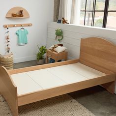 a child's bedroom with a bed and toys