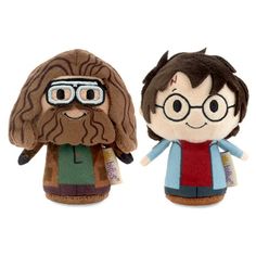 two harry potter dolls with glasses and beards, one is brown and the other is red