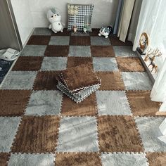 a brown and white checkered rug on the floor next to a window with curtains