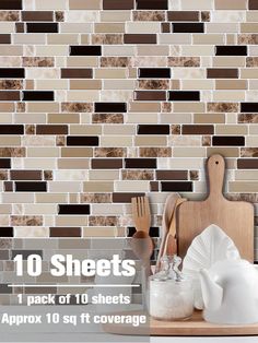 kitchen backsplash with brown and white tiles on the wall, including utensils