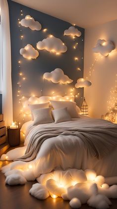 a bedroom decorated with lights and clouds on the wall