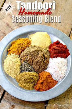 a bowl filled with spices sitting on top of a wooden table next to the words tandoori homemade seasoning blend