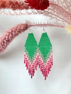 These ombre seed bead earrings with green and pink colors are made from selected Czech and Japanese beads. It can be an excellent personalized gift for bridesmaids, Mothers Day, birthdays, Valentine's Day, Wedding day, Christmas, New Year, and for your loved ones. ♡ Length - 4'' (10 Centimeters) ♡ Width - 1'' (2,5 Centimeters) ♡ Quality Czech and Japanese beads ♡ Stainless steel hooks/Silver 925 hooks I accept payments through Paypal. Also available in other colors: https://www.etsy.com/listing/ Green Faceted Bead Dangle Earrings, Green Faceted Beaded Dangle Earrings, Pink Beaded Earrings With Round Beads For Summer, Adjustable Green Earrings With Tiny Beads, Green Dangling Beads Earrings For Summer, Summer Green Dangling Beads Earrings, Colorful Beaded Green Jewelry For Summer, Summer Green Earrings With Dangling Beads, Summer Jewelry With Colorful Green Beads