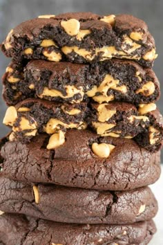 a stack of chocolate cookies with peanut butter on top