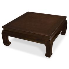 a wooden coffee table sitting on top of a white floor