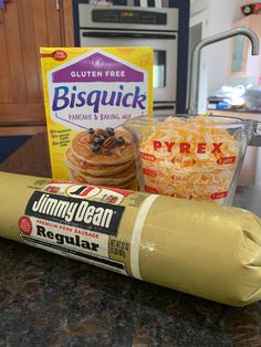 ingredients to make pancakes sitting on a countertop next to a package of biscuits