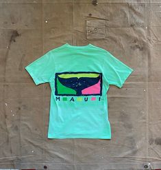 1990s Maui Surfboards tee by Crazy Shirt Hawaii. Unique sun fade / natural distressing throughout . 100% cotton tee. Good condition. Brand: Crazy Shirt Hawaii Size: M Bust: 18.5 inches Length: 26 inches Green 90s Style T-shirt For Summer, Green Washed T-shirt For Streetwear, Faded Retro T-shirt For Summer, Green Washed Graphic Tee, Summer Faded T-shirt With Screen Print, 90s Washed Short Sleeve T-shirt, 90s Style Washed Short Sleeve T-shirt, 90s Green Cotton T-shirt, 90s Style Green Cotton T-shirt