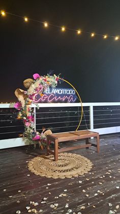 a wooden bench sitting on top of a wooden floor next to a sign that says el salvador