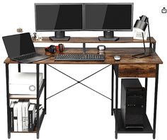 a computer desk with two monitors and a keyboard on it, along with other office supplies