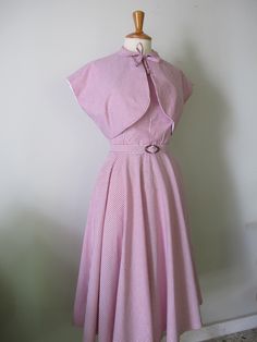 This 1950s style one-piece dress is made out of cotton fabric available in various fabric options! It features a halter bodice with an open back, peter pan collar with a front bow tie, circle skirt, and matching belt.(i use vintage buckles so they may be different from the ones in the pics) . Zips up the back with a hidden zipper a hook and an eye on the top. The bodice is fully lined with cotton lining! Available in all sizes. Pm me before you buy! I will need measurements for bust, waist, and Classic Summer Dress With Striped Collar, Classic Summer Dress With Peter Pan Collar, 1950's Dress, Circle Skirt Dress, 1950s Style, Dress Halter, 1950s Dress, 1950s Fashion, One Piece Dress