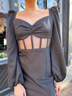 Looking for mix of modest and chic? Our Genesis Midi is a long sleeve midi length dress with a corset style midsection and a puff sleeve detailing. The slit up the side adds extra sass! Throw on a black heel for your next holiday party! Style Recommendations: - Pair with a tall black boot fo a chic date night look! - Add a black heel to dress her up for a wedding guest outfit! Product Description and Materials: - Black satin midi dress - Small v-neckline - Long sleeve, puff shoulder detailing - Dress With A Corset, Black Satin Midi Dress, Black Boots Tall, Black Heel, Next Holiday, Satin Midi Dress, Party Style, Long Sleeve Midi, Corset Style