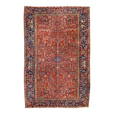 an antique persian rug with blue, red and orange colors on the border is shown