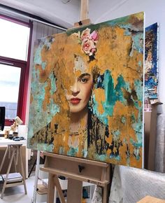 a painting is being displayed in an art studio