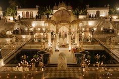 an elaborately decorated wedding venue at night