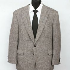 Vintage Harris Tweed Gray Brown Herringbone 2 Butt 1 Vent Sport Coat Men's Size 42 S Harris Tweed Gaede's Gray/Brown Scottish Wool Herringbone Pattern Half Lined Two Button Three Button Cuffs Single Vent Sport Coat Suit Jacket Formal Dress Business Casual Men's Size 42 S See Last Pic For Measurements. Wear No Damage Or Flaws Noted On The Outside. There Is A 1-2" Section Of Underarm Stitching That Has Come Loose. There Is A Small Spot On The Inner Lining Around The Top Middle Of The Back. Formal Tweed Blazer With Herringbone Pattern, Business Tweed Jacket With Herringbone Pattern, Semi-formal Herringbone Tweed Jacket, Tweed Herringbone Blazer For Business, Classic Formal Tweed Jacket With Herringbone Pattern, Formal Tweed Jacket With Herringbone Pattern, Formal Sport Coat With Herringbone Pattern And Suit Collar, Business Tweed Jacket, Gray Notch Lapel Tweed Jacket For Business