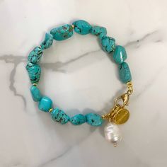 "Andromeda" bracelet regular size  This is an easy to wear  bracelet made of  irregular cut howlite stones in turquoise color tone . it is a easy to wear in everyday life . bracelet is decorated with a beautiful baroque pearl .  classical summer Basics .  it comes in two sizes and two metal details color tones , as linked to options in the drop menu .  💫please note that the shape of the stones will slightly vary .  💫it is an ideal gift idea  🔆you may also check my collection in the TURQUOISE Turquoise Howlite Bracelets With Natural Stones, Turquoise Natural Stone Bracelets, Natural Stone Bracelets For Gifts, Natural Stone Howlite Bracelets As Gift, Gem Stone Bracelet, Wire Wrapped Stone Jewelry, Bracelet Summer, Howlite Bracelet, Summer Bracelet