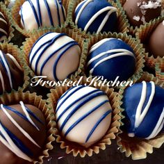 several chocolates are arranged in the shape of heart - shaped candies with white and blue stripes