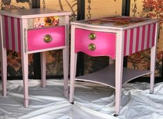 two pink and white tables with drawers on them