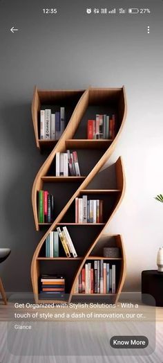 an image of a book shelf with books on it and a chair next to it