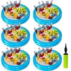 four inflatable plates filled with different types of fruit and beverages on top of each other