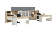 an office cubicle with two desks and one open file cabinet on the side