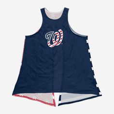 What this Washington Nationals Women's Americana Tie Back Sleeveless Top lacks in sleeves, it more than makes up for in patriotic team pride! Features All-over team-colored design on front so you can rep the team in style Team logo display and team-colored American flag-style wordmark team name display on front, in case there were any doubts where your allegiances lie Reverse side with two team-colored stars and stripes-designed tie-able ends that will look great at every Memorial Day and Fourth Team Spirit Tank Top For Summer Sports, Team Spirit Tank Top For Sports In Summer, Team-colored Sports Fan Tops For Events, Team-colored Tops For Sports Fans, Team-colored Tops For Sports Events, Team-colored Sports Fan Tops For Sports Events, Navy Tops With Team Logo For Sports Season, Navy Tops With Team Logo For Fan Gear, Collegiate Navy Tops For Baseball Season