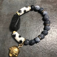 Lava Rock Krobo Glass & Brass Mask Mens Bracelet Gemstone | Etsy Bohemian Lava Stone Bracelets For Gift, Bohemian Lava Stone Bracelet As Gift, Spiritual White Bracelet With Black Beads, African Inspired Jewelry, Gray Bracelet, S Bracelet, Hex Nut, Recycled Glass Bead, Tiger Eye Bracelet