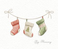 three christmas stockings hanging on a clothesline with the words by memory written below them