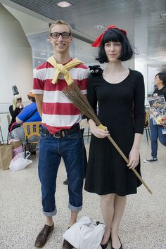 a man and woman are dressed up in costumes