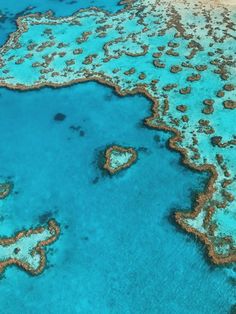 an aerial view of the great barrier reef and heart - shaped corals in australia