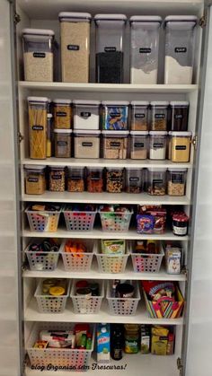 an organized pantry with bins and baskets