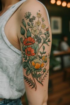 a woman with a flower tattoo on her arm