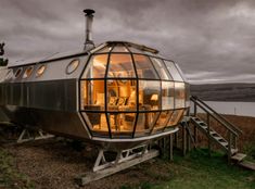 an unusual house built into the side of a hill