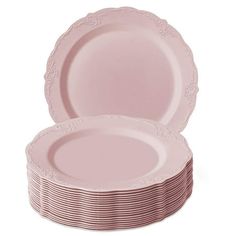 pink plates stacked on top of each other with lace trim around the edges and edge