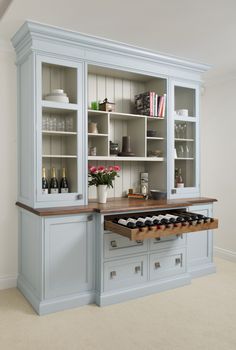 a kitchen with an island and built in bookcases next to the counter top