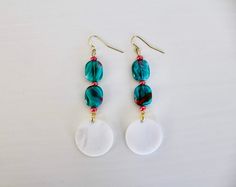 Teal and red glass beads with dangling white, circular shell pendants repurposed from old jewelry. White Bohemian Earrings With Czech Glass, Artsy Jewelry, Beautiful Veil, Teal Earrings, Boho Gifts, Earrings White, Old Jewelry, Earrings Blue, White Earrings