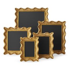 three gold framed pictures on a white background, each with a blackboard in the middle