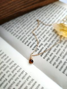 ✨ Dainty Tiger's Eye Necklace ✨ Handmade with choices of 14K Gold Filled, Rose Gold Filled, and Sterling Silver 🧡 A stone for self-confidence, empowerment, and inner strength. Tiger Eye is traditionally used as a protective amulet to ward off evil. With a grounding and healing property, it is a healing stone for root and sacral chakra. 🧡 • Pendant size: 1 x 0.5 cm • Gold-filled and Sterling Silver is known for its lasting quality. With proper care, this necklace will last its color & shine for Amber Birthstone Dainty Necklace, 14k Gold Amber Necklace, 14k Gold Amber Round Necklace, Handmade Gold Birthstone Necklace For Everyday, Everyday Gold Birthstone Necklace Handmade, Everyday Handmade Gold Birthstone Necklace, 14k Gold Amber Necklace For Gift, Protective Amulet, Tiger Eye Necklace