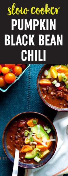 two bowls of slow cooker pumpkin black bean chili on top of a blue towel