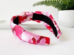 ∙ Red and pink floral print∙ 1 1/2" knot and 2 1/2" side width∙ 1" comfort fit width band This beautiful summer floral knotted silk headband is the perfect accessory to add a touch of elegance and comfort to any outfit. The lightweight and silky soft material gently rests on your head, providing a cozy and comfortable fit all day long. The delicate floral print adds a touch of feminine charm, while the knotted design at the top adds a touch of bohemian chic. The headband is perfect for keeping y Red Headband For Spring, Red Headband Hair Accessories For Spring, Red Spring Headband, Adjustable Red Headband For Spring, Adjustable Red Headband For Summer, Silk Headband, Pink Summer, Summer Floral, Knot Headband