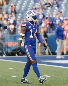 a football player is walking on the field