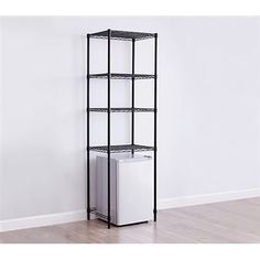 a black shelving unit with four shelves and two white boxes on the bottom shelf