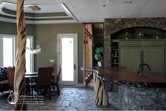 a kitchen and dining room with stone flooring